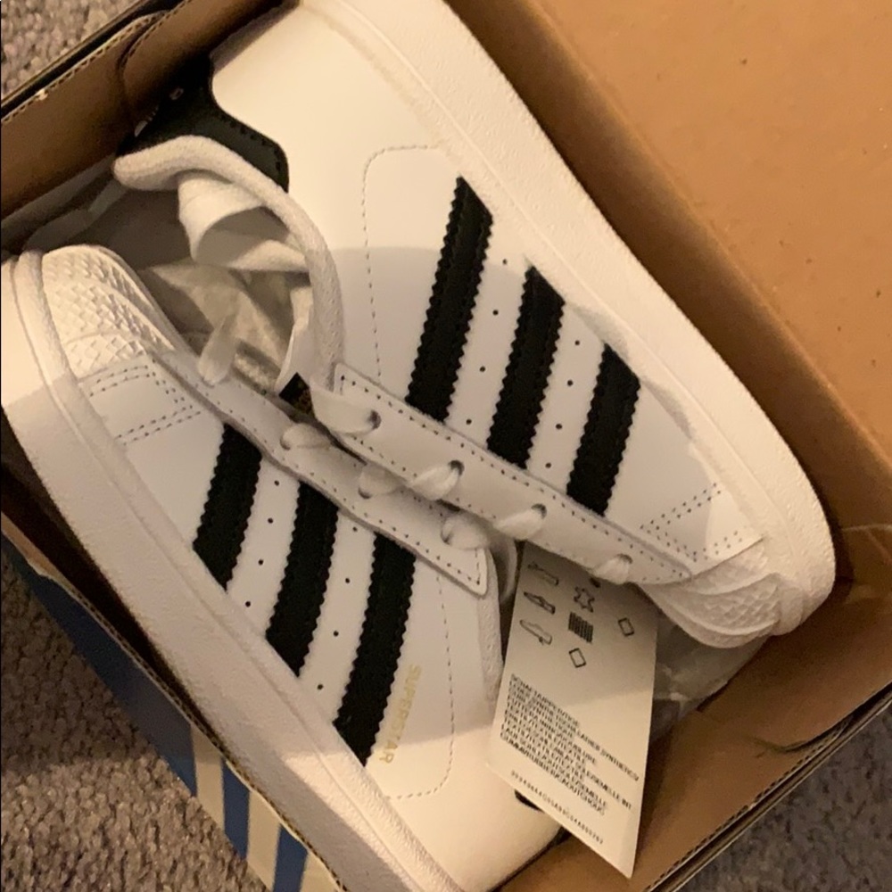 White and black adidas oringals